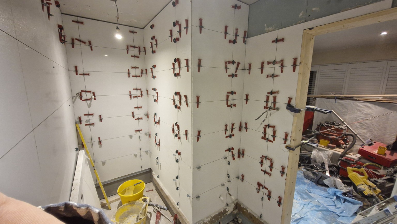 Large-format wall tiling in progress