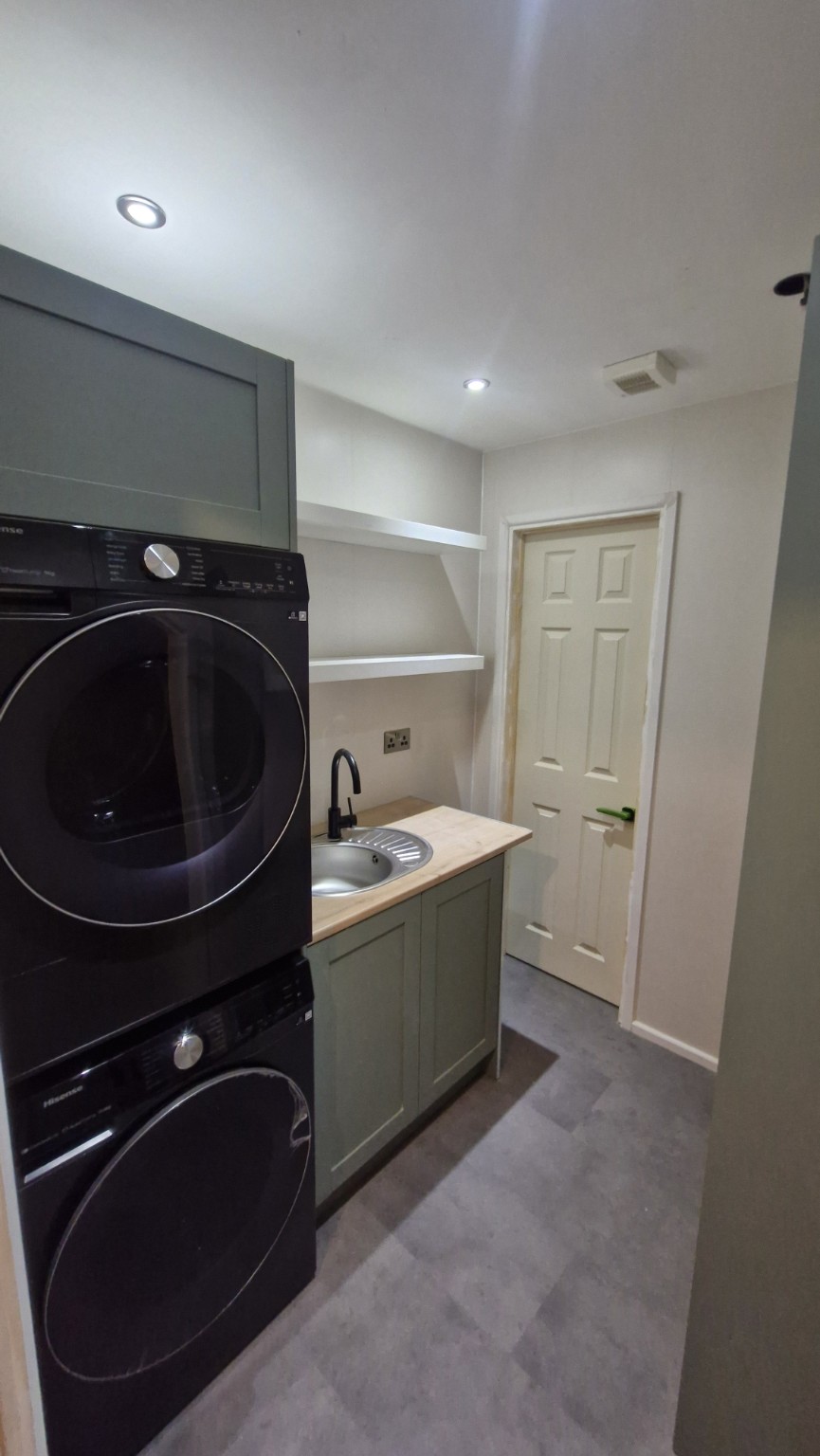 Utility sink, worktop and stacked appliances