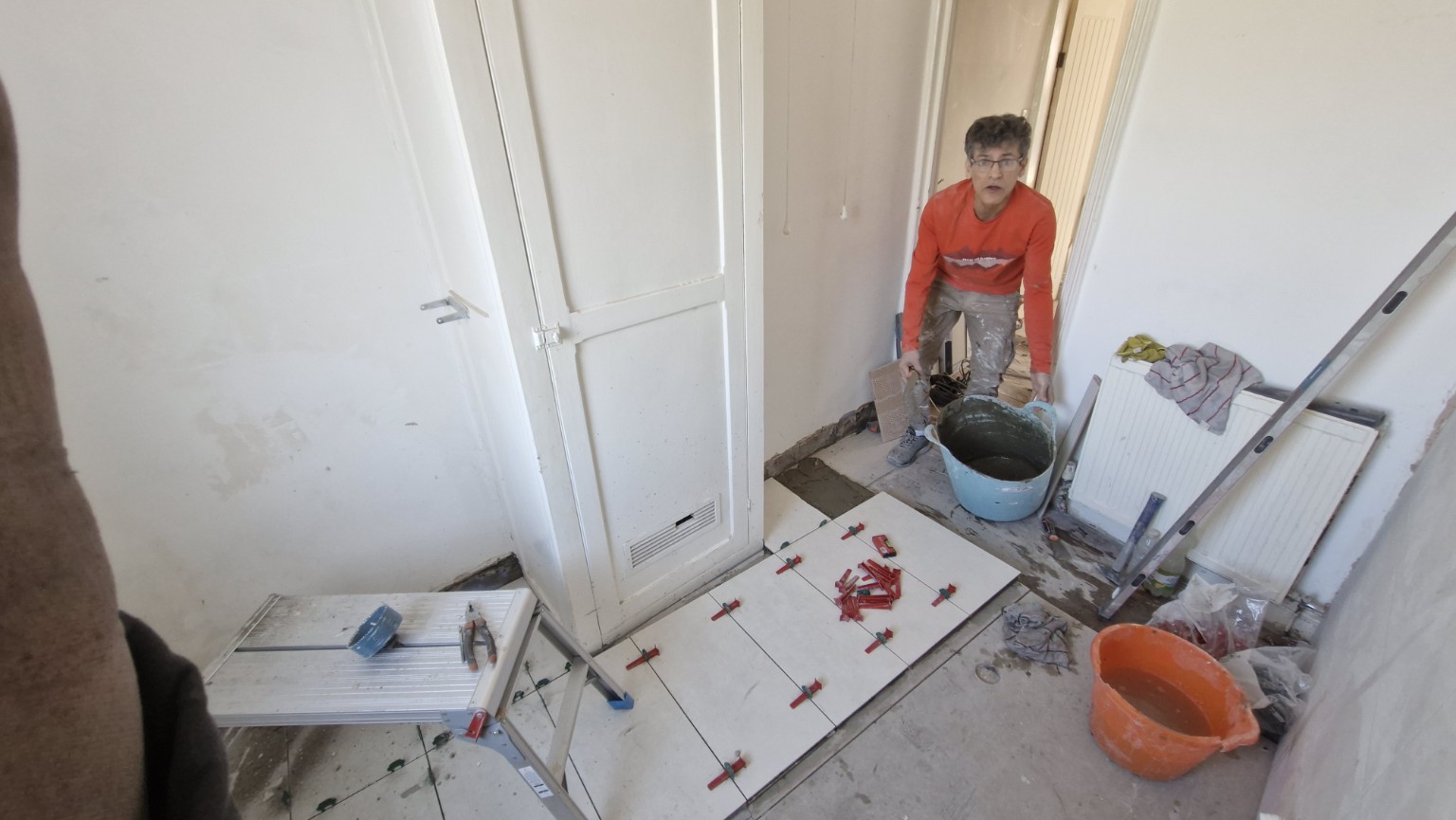 Floor tiling and finishing work in progress