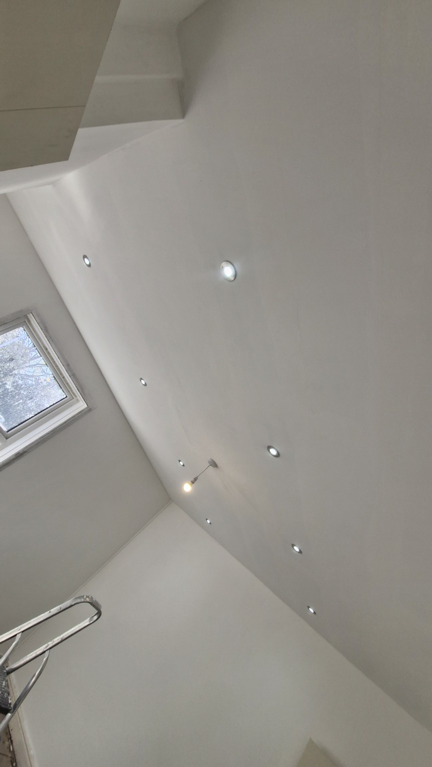 Finished white ceiling with recessed lighting