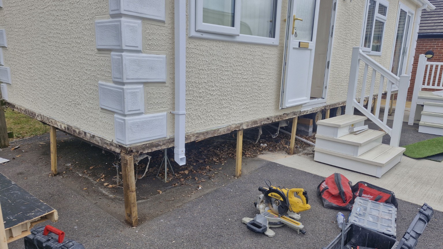 Damaged lower exterior cladding removed
