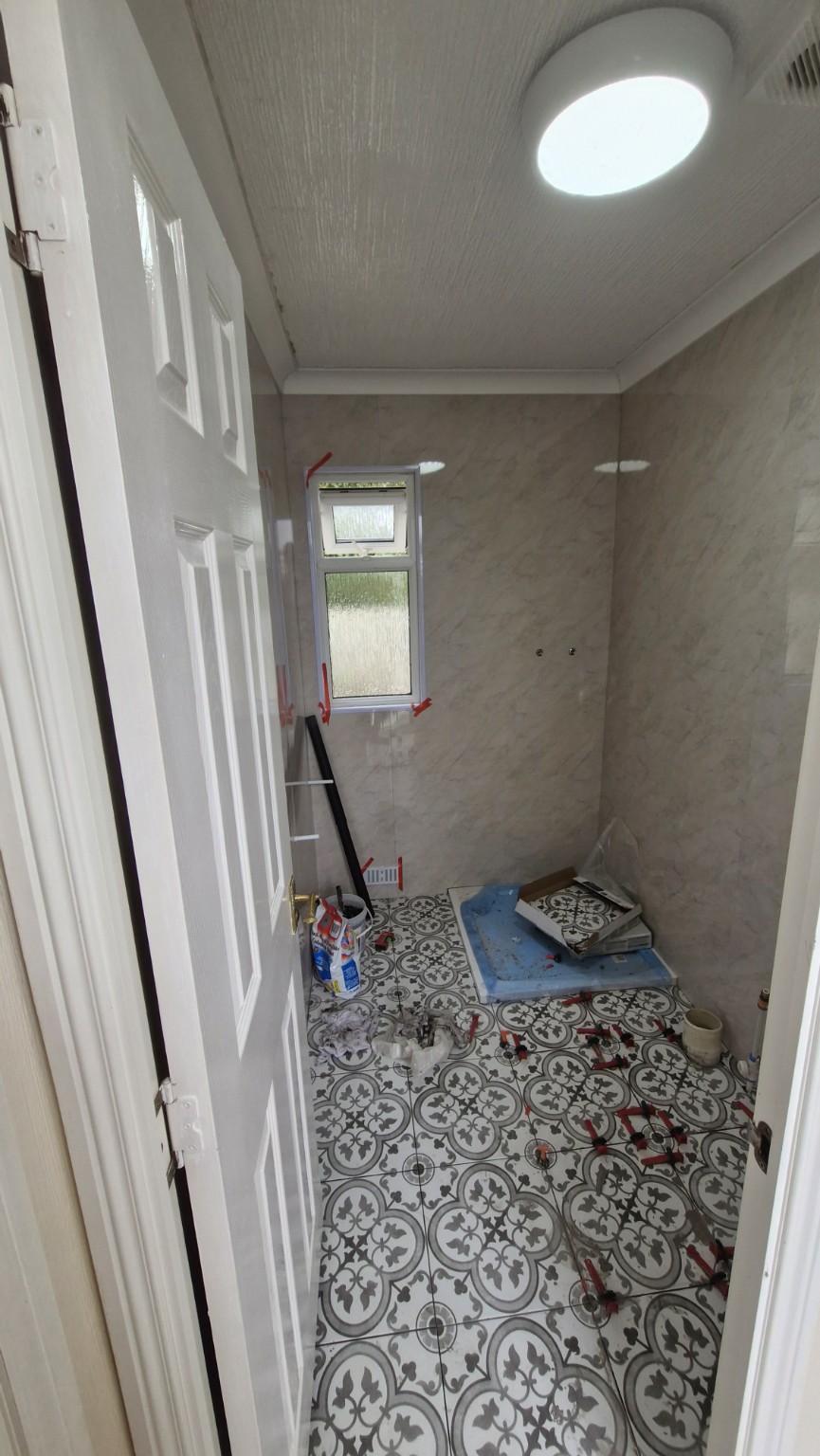 Decorative floor tiling underway