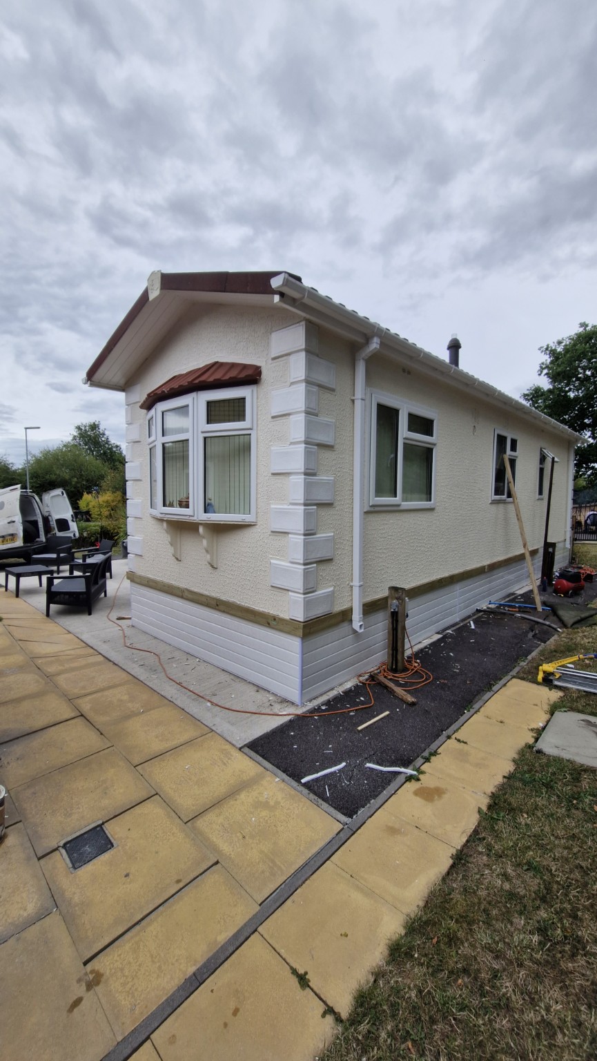 Front and side showing new exterior cladding
